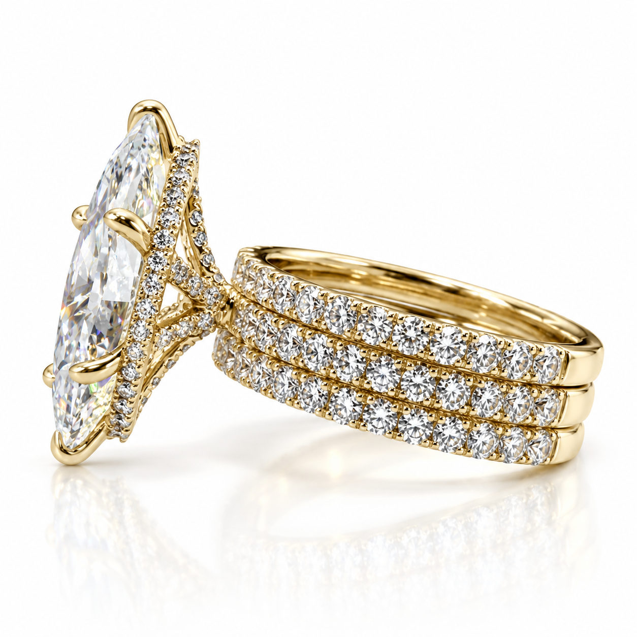Juliana marquise diamond ring in 18K yellow gold, side detail showing the three soldered French pavé bands and hidden halo