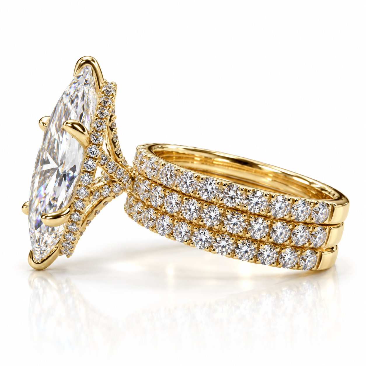 Juliana marquise diamond ring in 18K yellow gold, side profile showing the three soldered French pavé bands and hidden halo