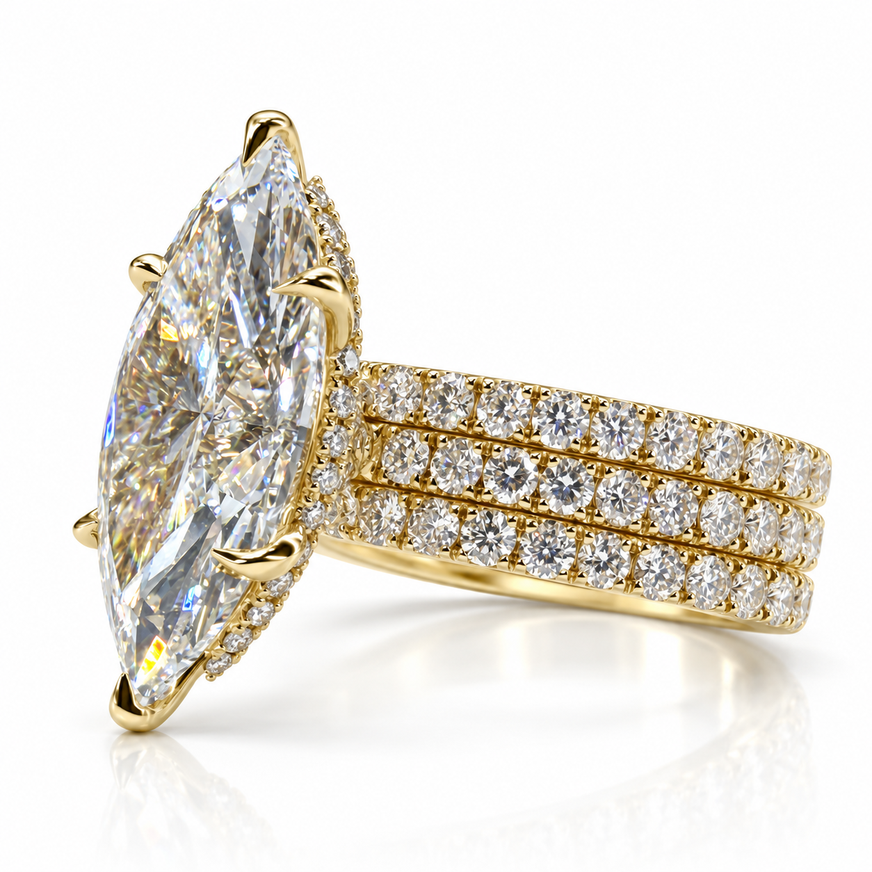 Juliana marquise diamond ring in 18K yellow gold, three quarter showing the three soldered French pavé bands and hidden halo
