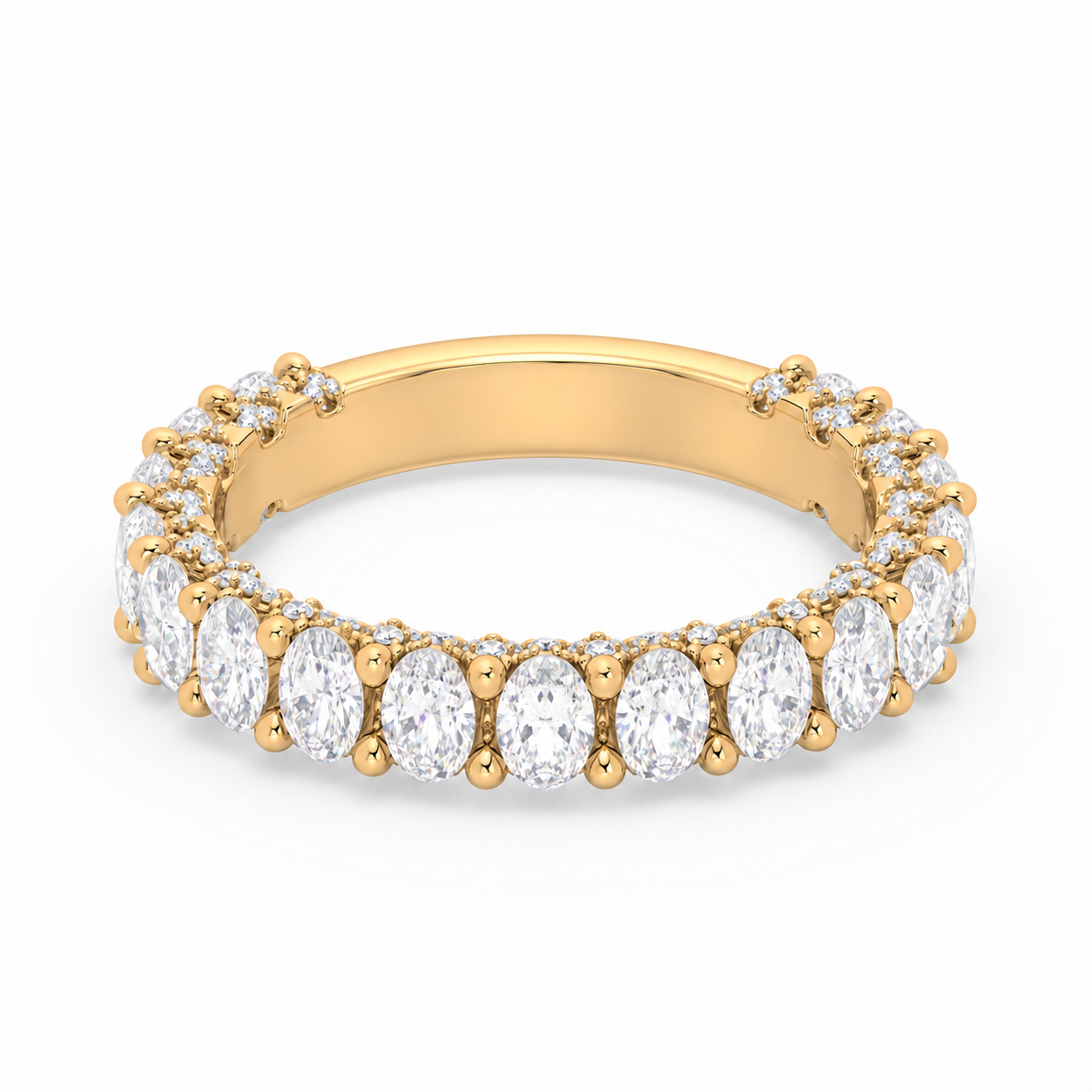 Olivia 3.4 mm yellow gold wedding band with elongated oval diamonds, approximately 75–80% diamond coverage and a smooth rear resizing bar
