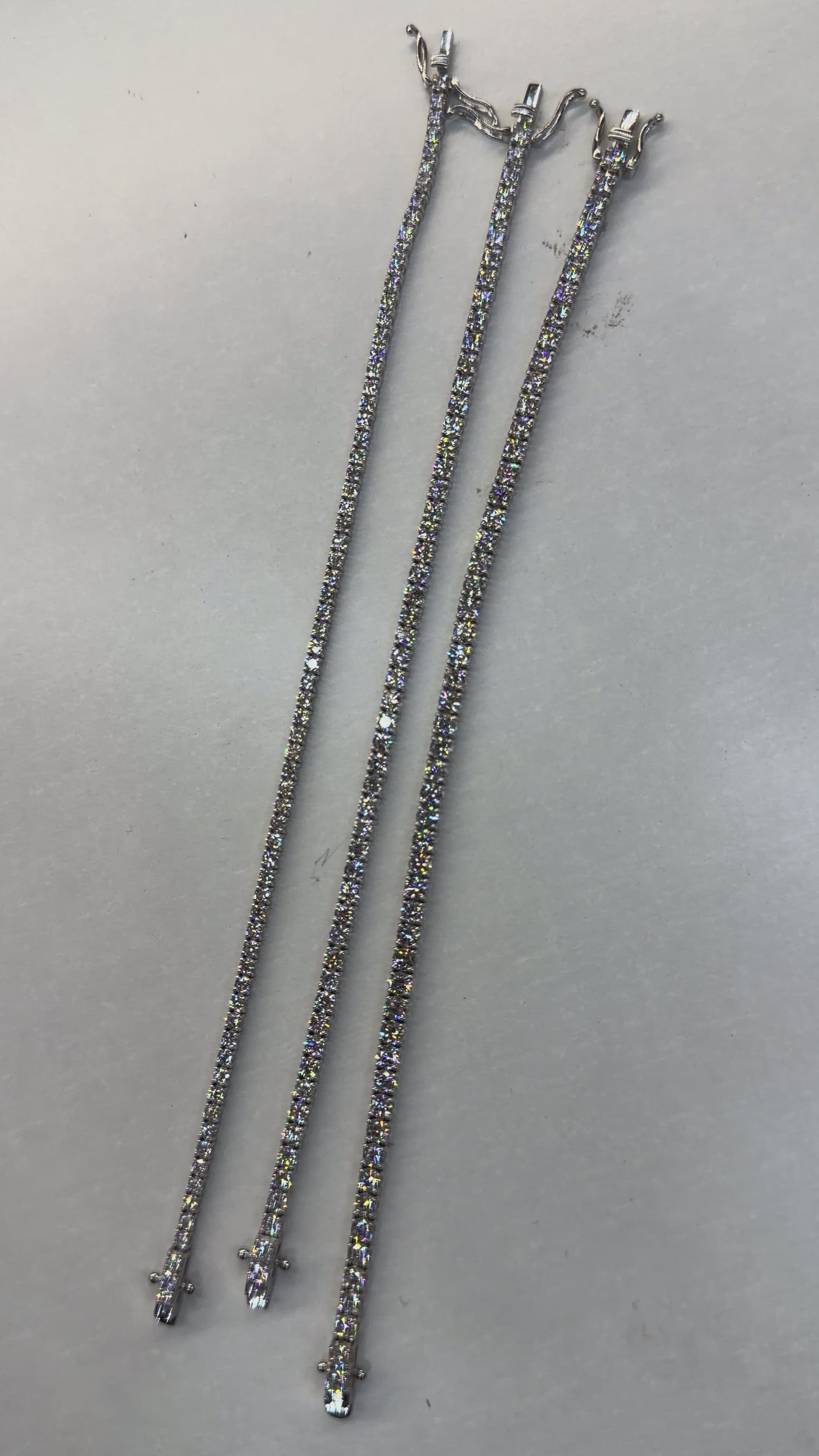 Pulsera de tenis redonda de 4 puntas con doble seguro