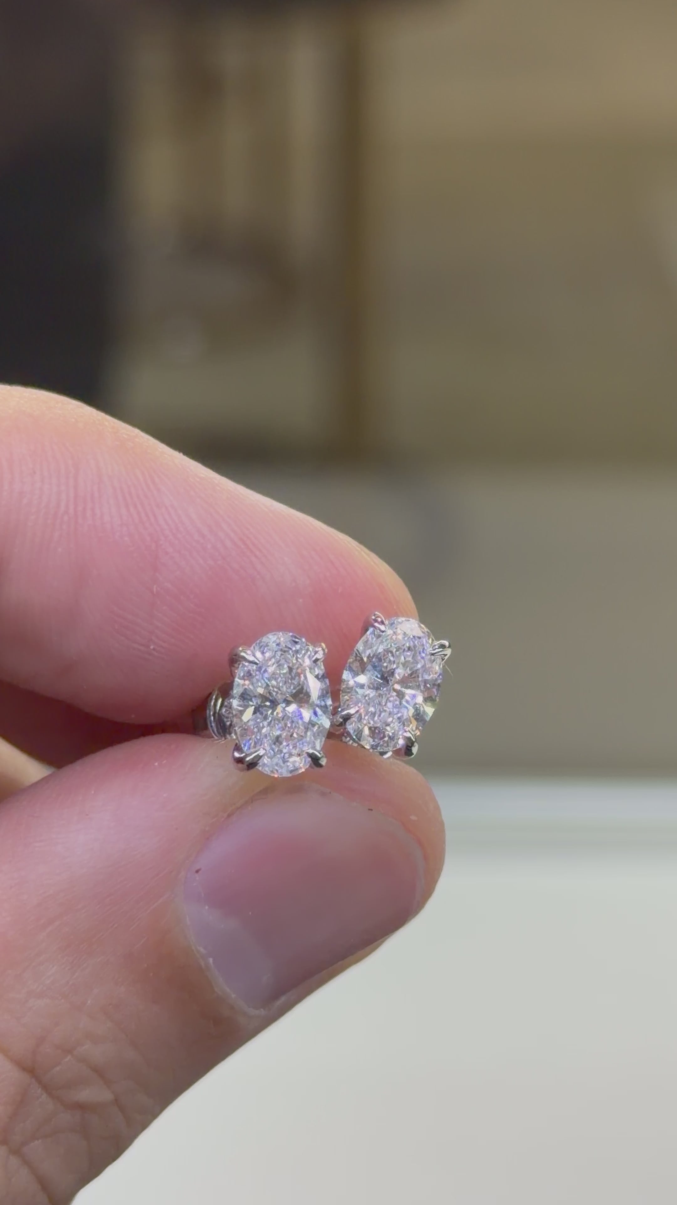 Oval Hidden Halo Stud Earrings