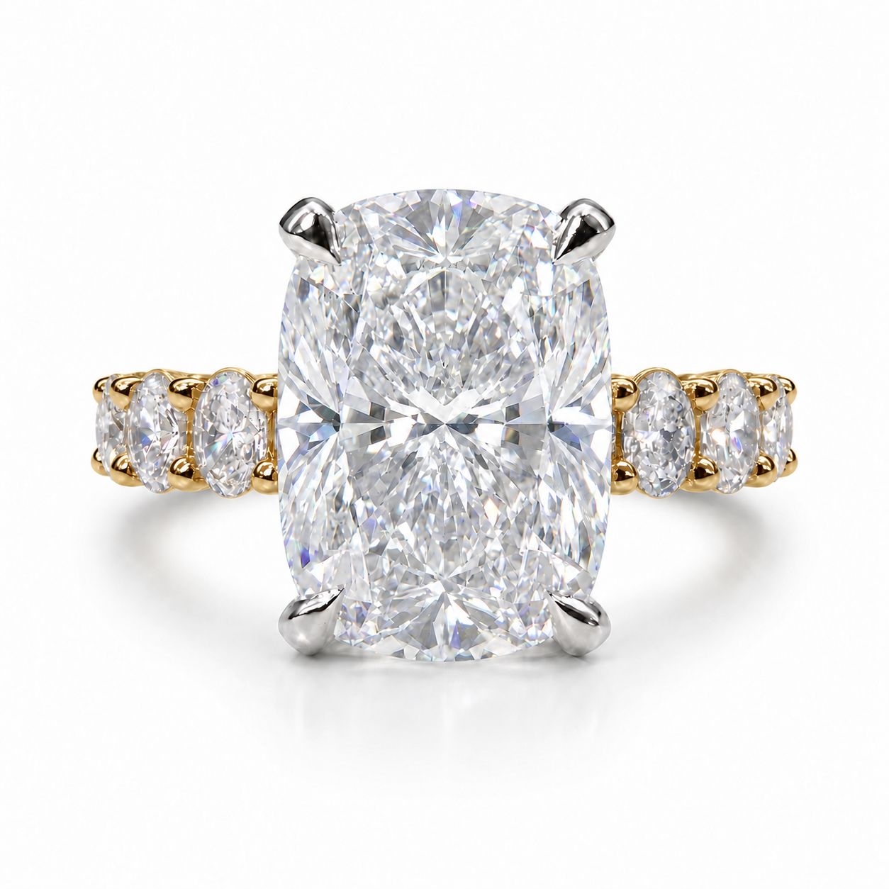 The 3MM Olivia engagement ring with a cushion lab-grown center diamond in two-tone gold with white center prongs