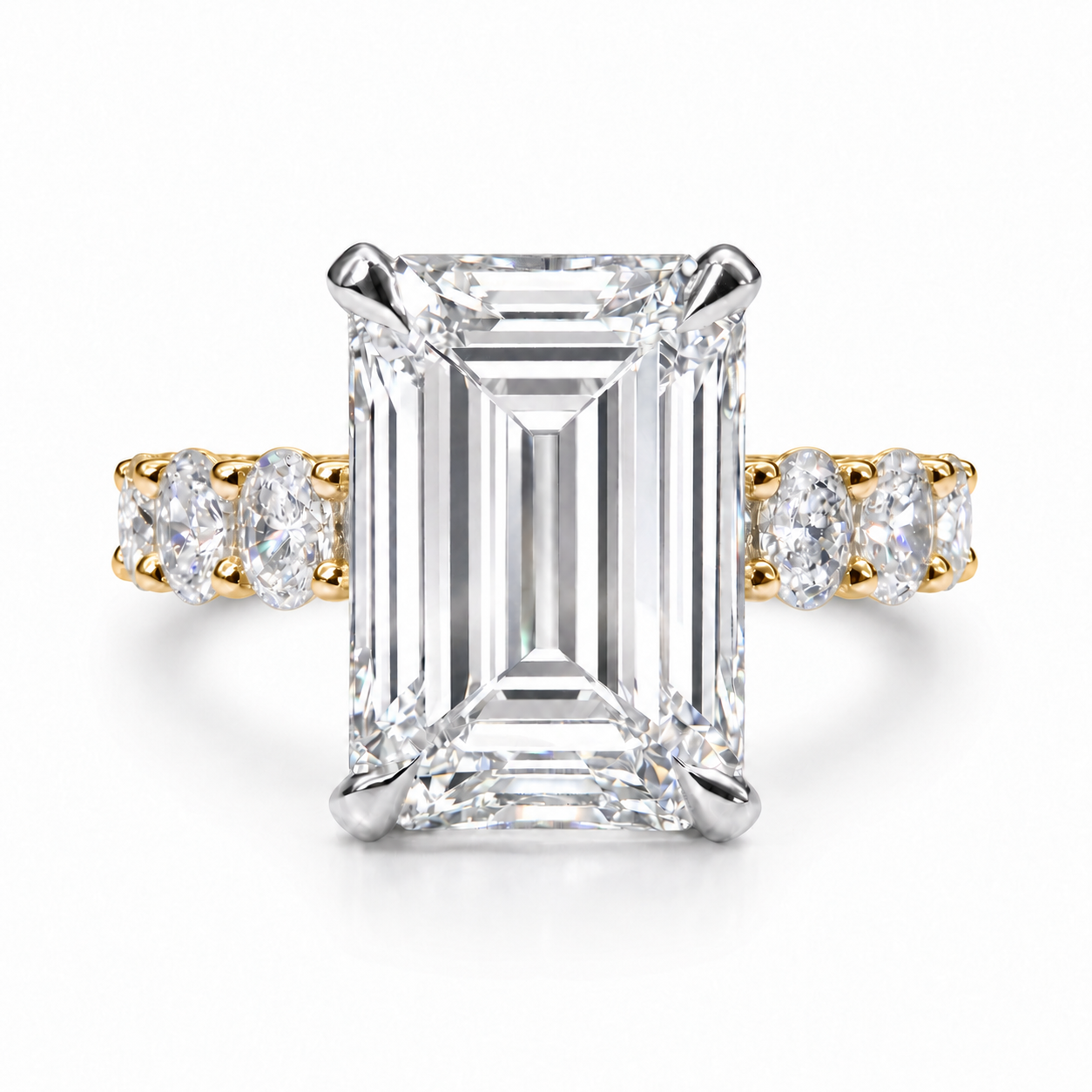 The 3MM Olivia engagement ring with an emerald lab-grown center diamond in two-tone gold with white center prongs