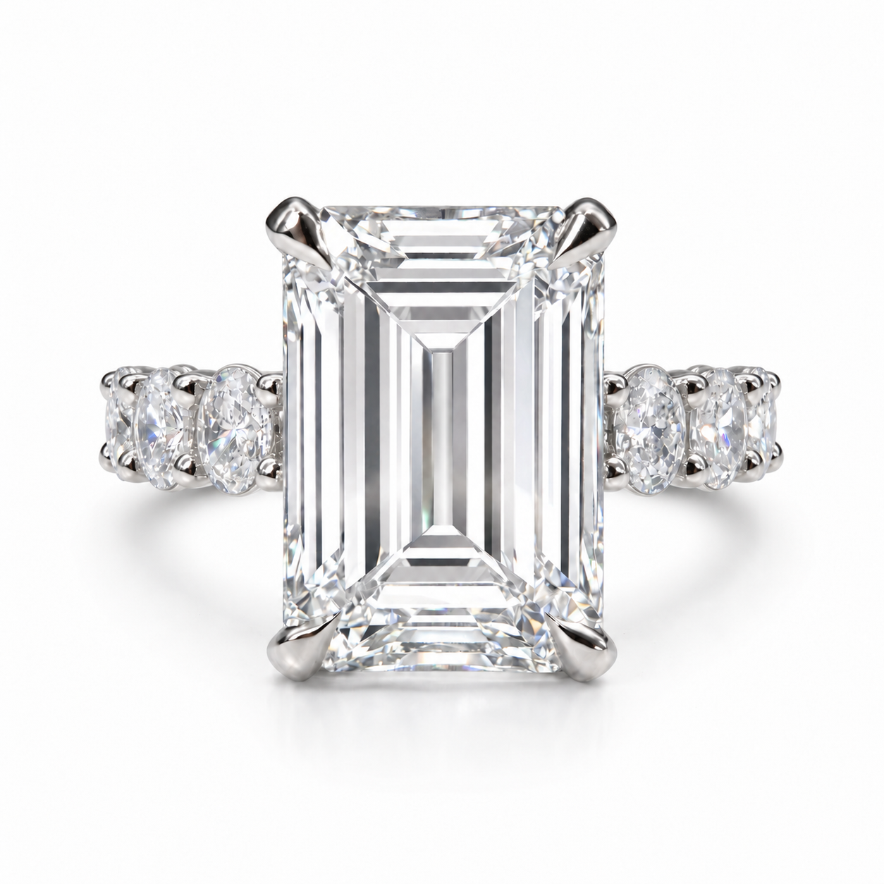 The 3MM Olivia engagement ring with an emerald lab-grown center diamond in a white-metal finish