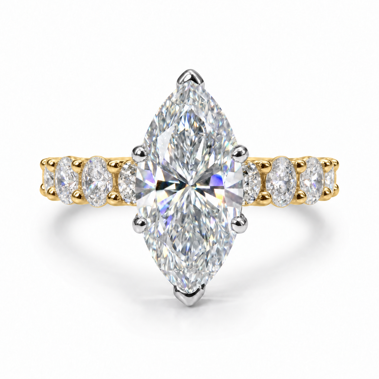 The 3MM Olivia engagement ring with a marquise lab-grown center diamond in two-tone gold with white center prongs