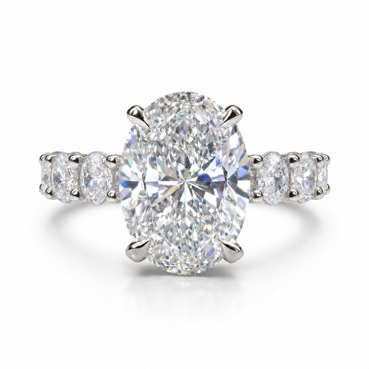 The 3MM Olivia engagement ring with an oval lab-grown center diamond in a white-metal finish