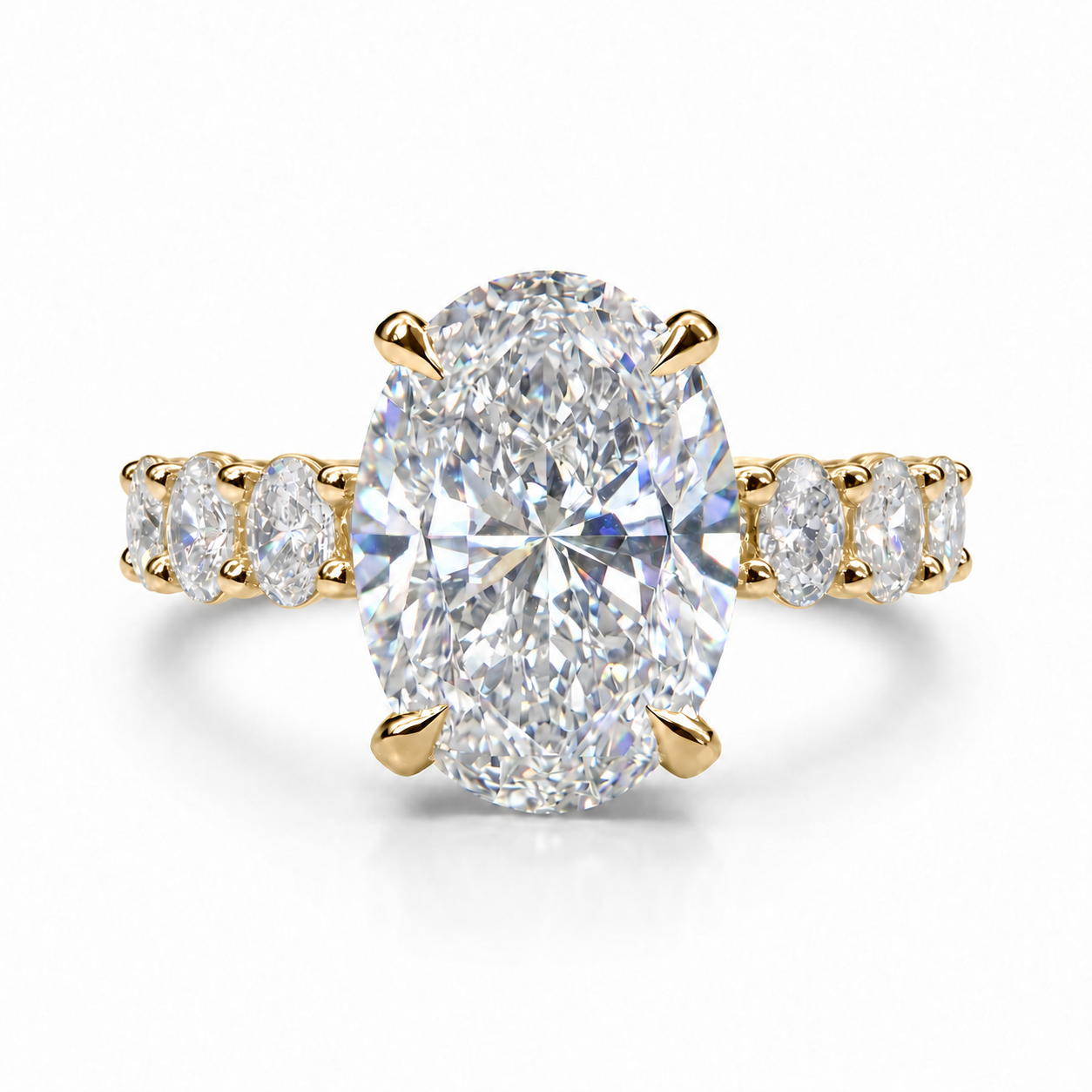 The 3MM Olivia engagement ring with an oval lab-grown center diamond in yellow gold