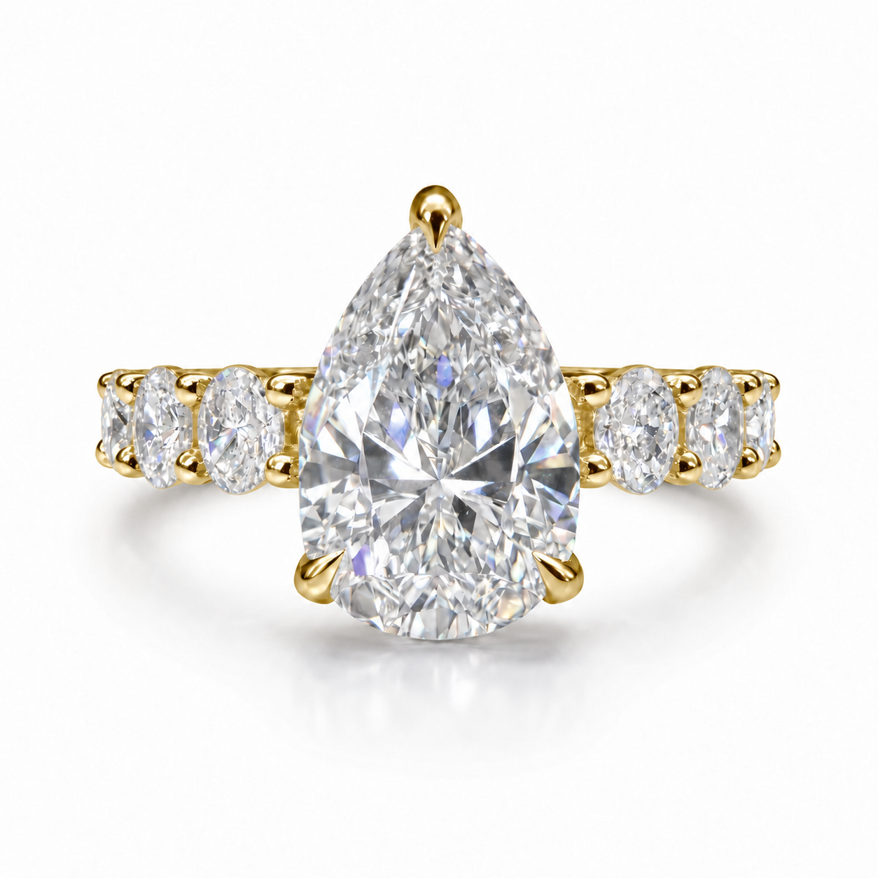 The 3MM Olivia engagement ring with a pear lab-grown center diamond in yellow gold